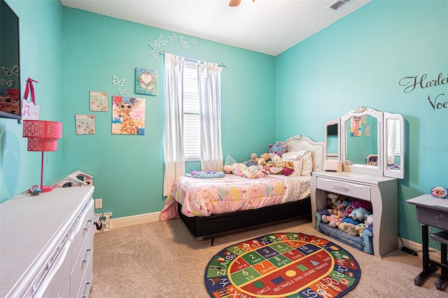 bedroom featuring ceiling fan and light carpet