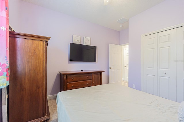 19501 Sea Myrtle Way, Tampa, FL 33647 - bedroom with carpet flooring, a closet, baseboards, and ceiling fan