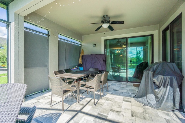 view of patio featuring ceiling fan