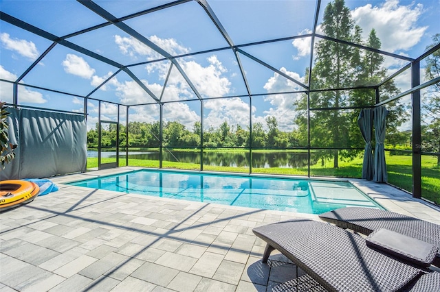 view of pool featuring a lanai, a water view, and a patio