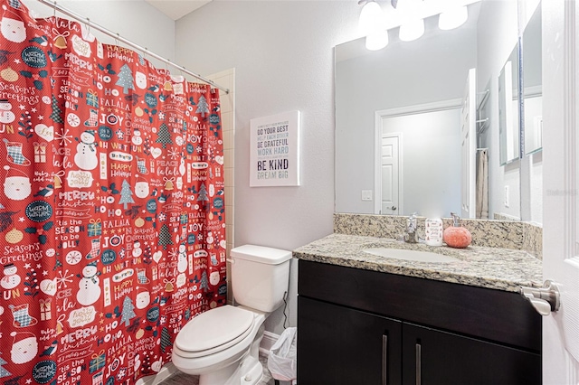 bathroom with vanity, toilet, and a shower with curtain