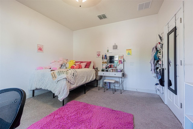 carpeted bedroom featuring ceiling fan