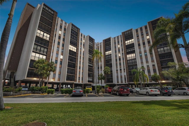 view of building exterior featuring uncovered parking