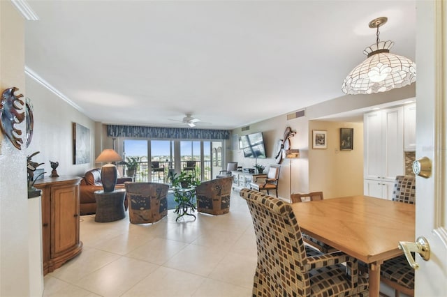 dining room with ceiling fan, light tile patterned flooring, and visible vents