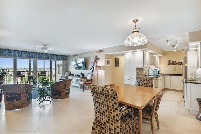 dining area with visible vents, ceiling fan, and light tile patterned floors