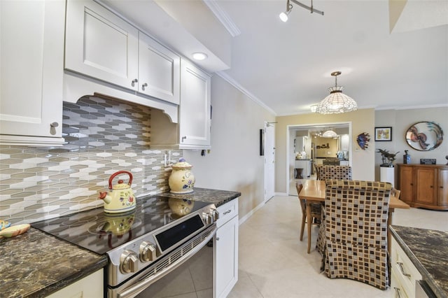 kitchen with crown molding, stainless steel electric range oven, decorative backsplash, and white cabinetry