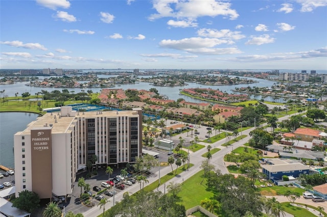 drone / aerial view featuring a view of city and a water view
