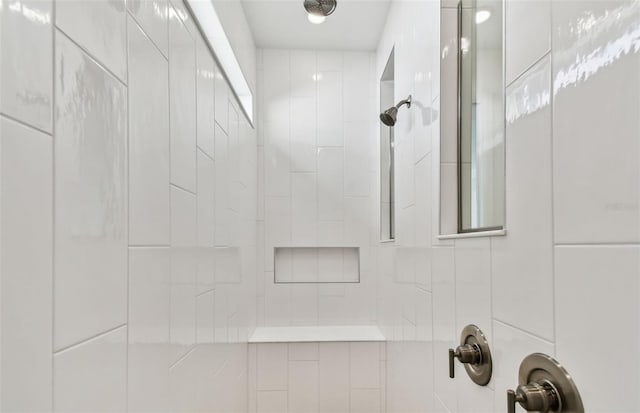 bathroom featuring tiled shower