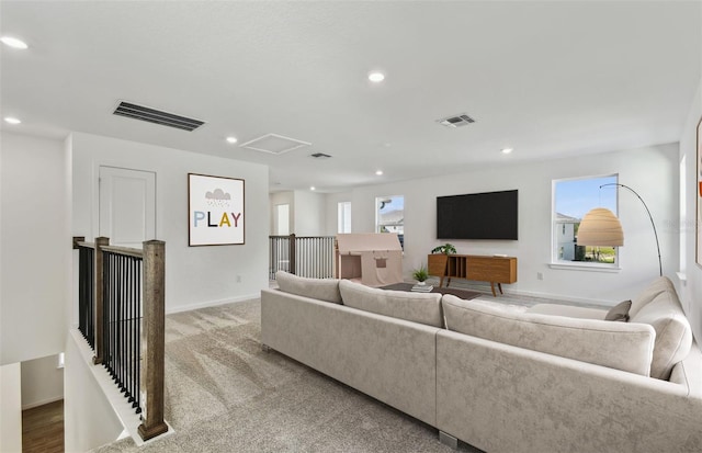 carpeted living room featuring a wealth of natural light