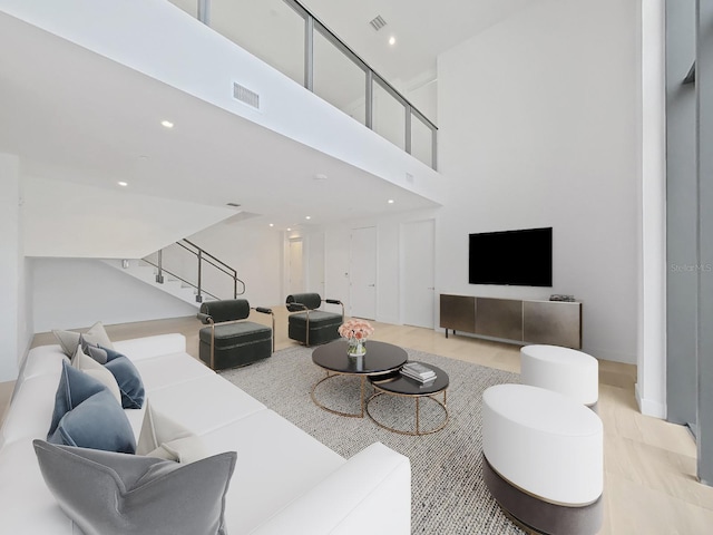 living room with a high ceiling