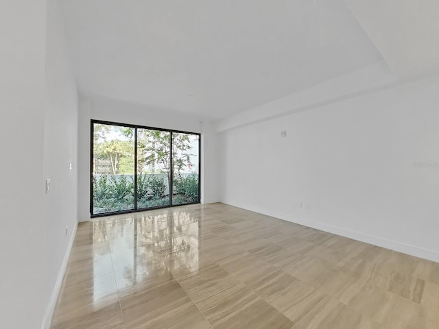 empty room with light tile patterned floors