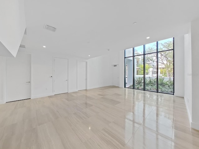 empty room featuring floor to ceiling windows