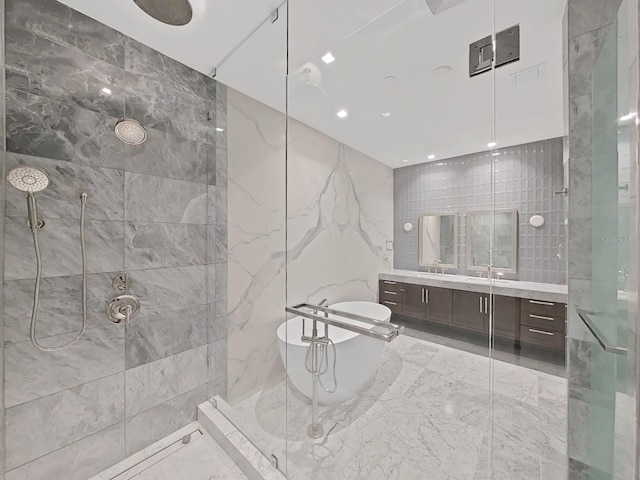 bathroom featuring vanity and separate shower and tub