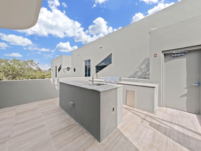 view of patio featuring area for grilling, an outdoor kitchen, and sink