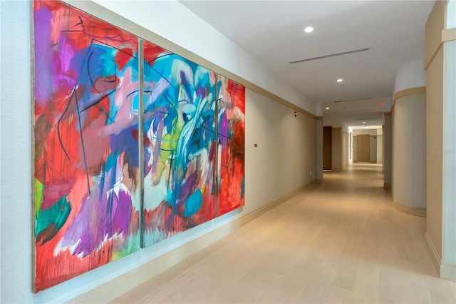 hallway with light hardwood / wood-style flooring