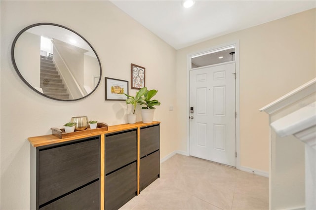 entryway featuring light tile patterned flooring