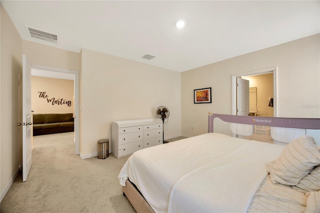 bedroom with light colored carpet