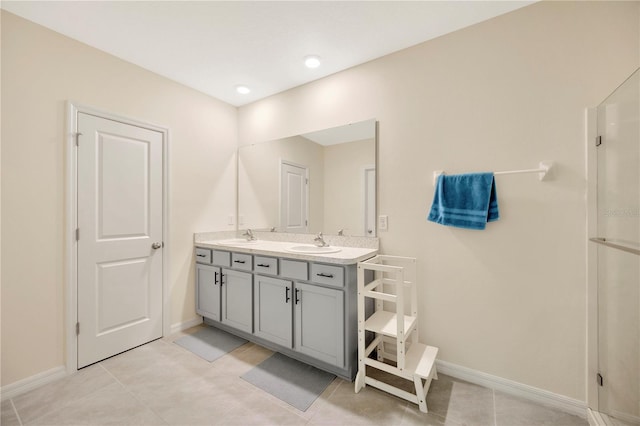 bathroom with vanity and tile patterned flooring