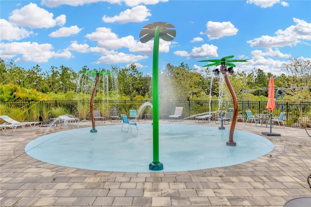 view of jungle gym with a patio area