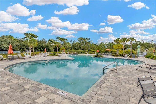 view of swimming pool featuring a patio