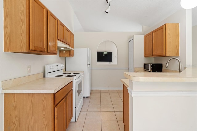 kitchen with a textured ceiling, sink, light tile patterned floors, and white range with electric stovetop