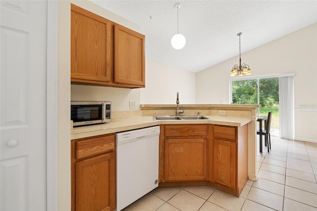 kitchen with dishwasher, a chandelier, sink, lofted ceiling, and decorative light fixtures