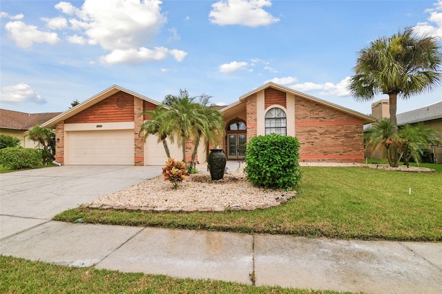 view of front of house featuring a garage and a front lawn