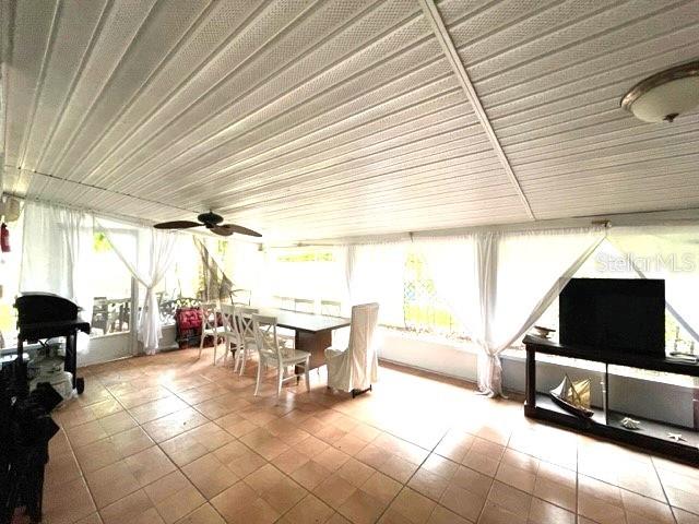 sunroom / solarium featuring plenty of natural light