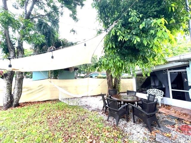 rear view of property featuring a patio