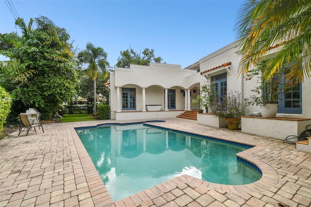 view of pool featuring a patio