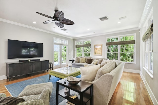 living room featuring ornamental molding, ceiling fan, and light hardwood / wood-style floors