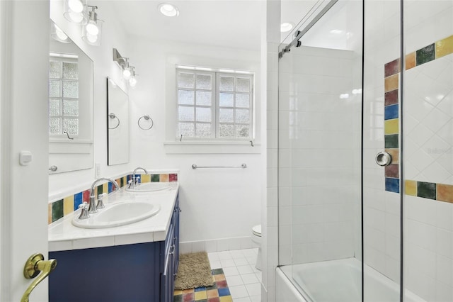 bathroom featuring vanity, toilet, and tile patterned floors