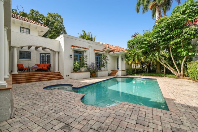 view of swimming pool featuring an outdoor living space and a patio