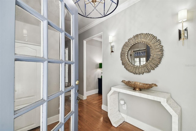 hallway featuring ornamental molding and dark hardwood / wood-style floors