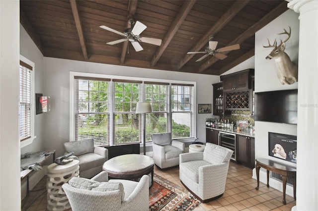 tiled living room featuring wood ceiling, beverage cooler, and ceiling fan