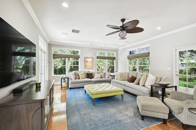 living room featuring crown molding, ceiling fan, and hardwood / wood-style flooring