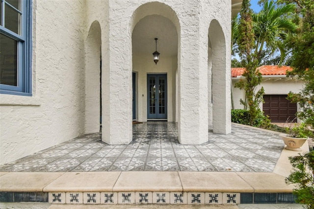 doorway to property with a garage