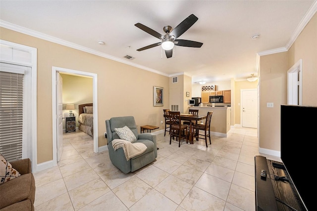 living room with crown molding and ceiling fan