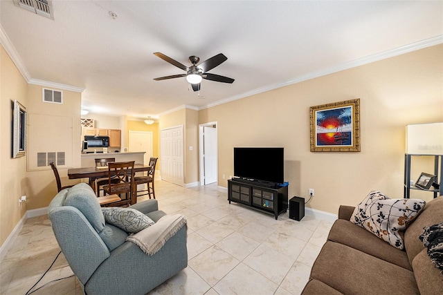 living room with crown molding and ceiling fan