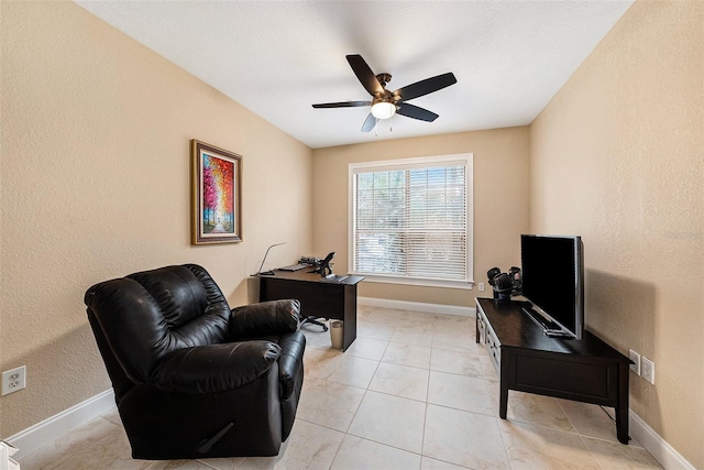 office featuring light tile patterned floors and ceiling fan