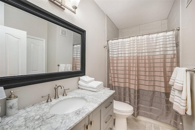 bathroom with vanity, a shower with curtain, and toilet