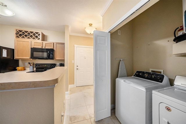 laundry area featuring crown molding, independent washer and dryer, and light tile patterned floors