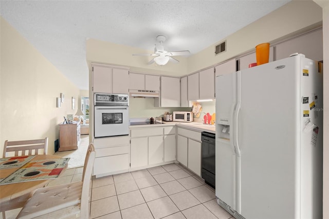 kitchen with black appliances, ceiling fan, and white cabinets