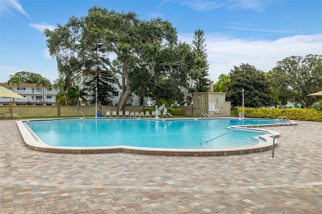 view of swimming pool with a patio area