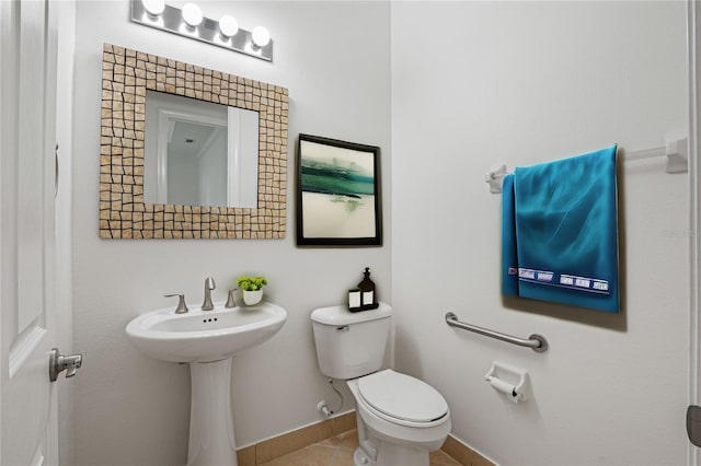 bathroom featuring tile patterned flooring and toilet