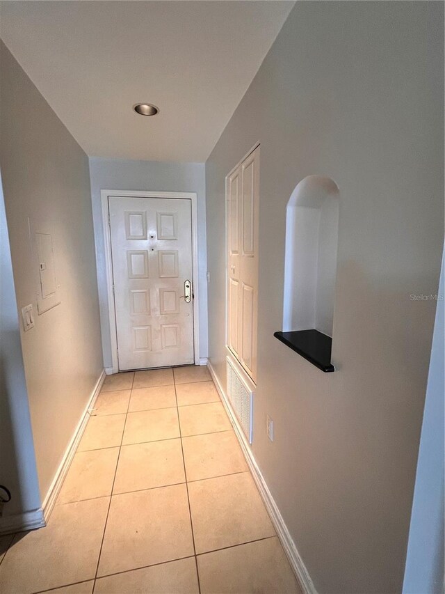 hallway featuring light tile patterned floors