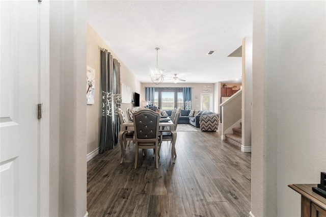 dining area featuring an inviting chandelier and hardwood / wood-style flooring