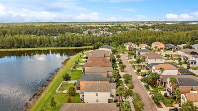 drone / aerial view with a water view and a residential view