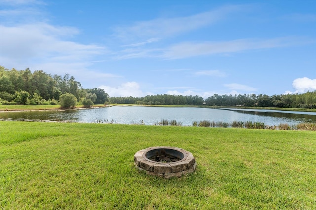 property view of water featuring a fire pit