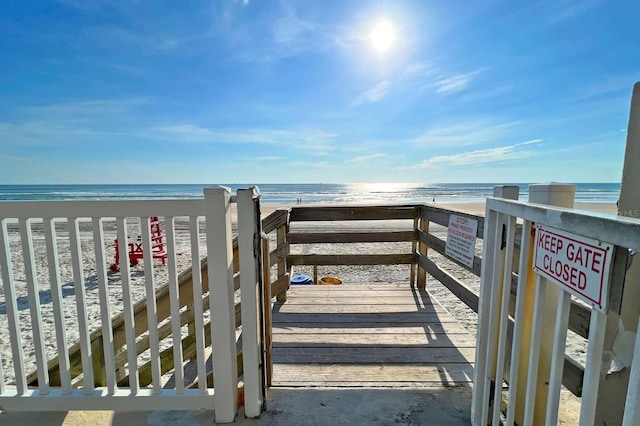 view of community with a view of the beach and a water view